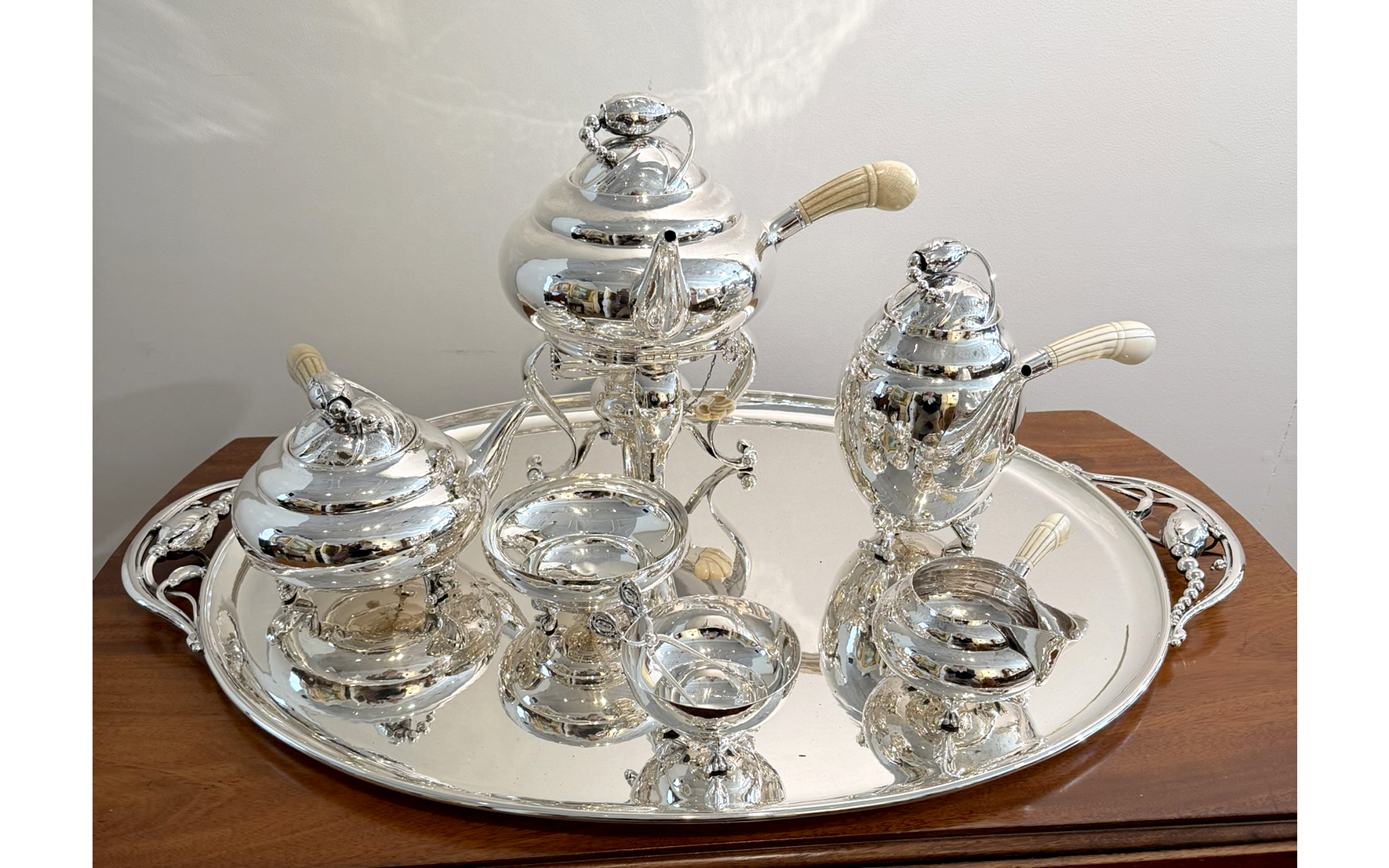GEORG JENSEN BLOSSOM STERLING SILVER 
NINE PIECE TEA AND COFFEE SERVICE
Denmark, 20th century.
